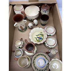 Collection of motto ware to include Torquay examples, including puzzle jug, bowls, teapot, jugs, cups, etc in two boxes