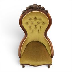 Victorian mahogany green upholstered nursing chair, balloon back with carved cresting rail, button back upholstered with low swept arms, raised on cabriole supports