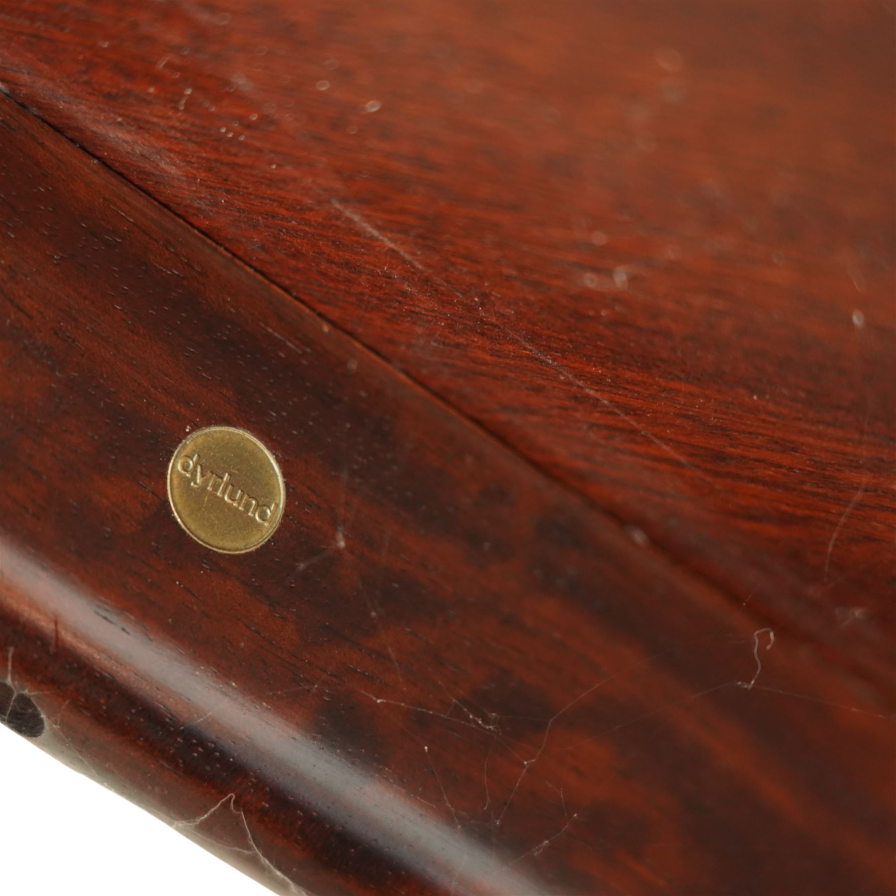 Dyrlund - contemporary Santos rosewood coffee table, floating design, square top of elegant design with clean lines and chamfered square legs 

Note: Dyrlund is a Danish furniture manufacturer known for its high-quality, handcrafted pieces, particularly in the mid-century modern style. Founded in 1960 by Frits Hjerte Dyrlund in Rude, Denmark, the company has remained a family business, now run by the second and third generations. Dyrlund specializes in both home and executive office furniture, focusing on practicality, solid construction, and classic design