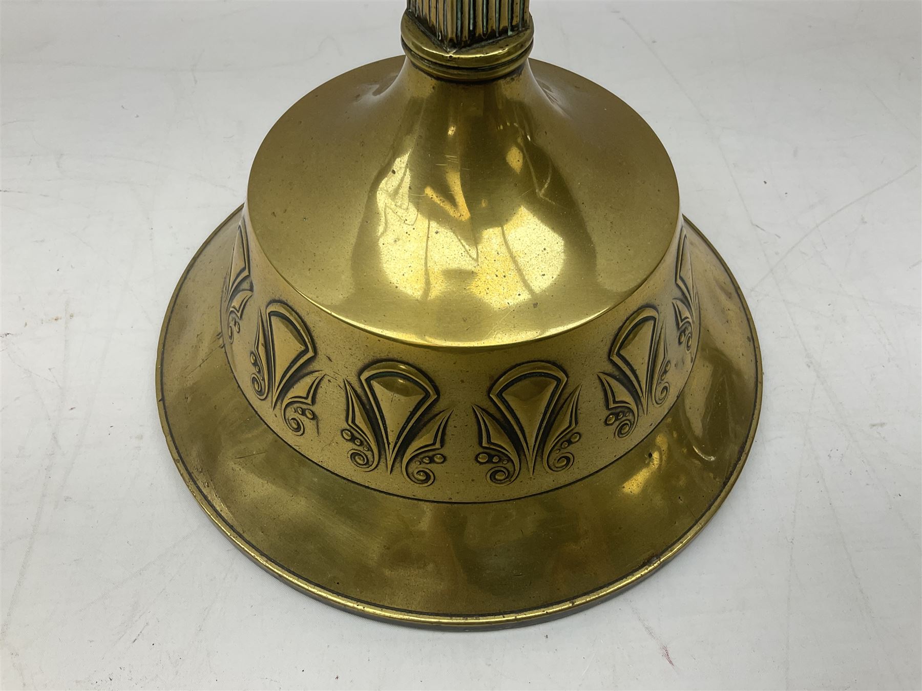 Early 20th century Daalderop of Holland Art Nouveau brass smokers stand, the square sided column stem raised upon circular spreading base with mounted ash tray decorated with typical Art Nouveau stylised motifs, with mark beneath, H72cm