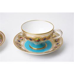 Brown-Westhead, Moore & Co cabinet cup and saucer, with rope twist moulded handle, hand-painted with floral reserves against a white and sky blue ground, heightened profusely with gilt, together with a pink hand-painted example, and a 19th century spill vase and twin-handled covered sucrier (4)