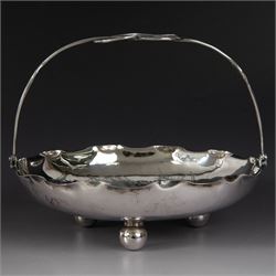 Chinese export silver swing handled basket, of circular for with crimped rim and knotted wirework handle, engraved with a dragon to centre, upon three bun feet, with maker's mark T.H, character marks and 95 to underside, including handle H17cm