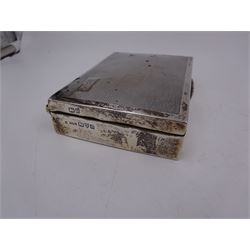 1920s silver mounted cigarette box, of rectangular form, with engraved initials and engine turned decoration to hinged cover, opening to reveal softwood interior, hallmarked E J Trevitt & Sons, Chester 1929, together with a silver handled button hook and shoe horn, and a mother of pearl handled silver fruit knife, all hallmarked, cigarette case W11.5cm, D8.5cm, H3.5cm
