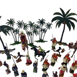 Britains lead figures circa 1930, comprising eight 'Grenadier Guards', seven 'Royal Marines', eight pre-war 'Greek Evzones', eight 'Zulu Warriors', six marching 'Bedouin Arabs' and two on horseback, five 'Arabs of the Desert' including two on horseback and three mounted on camels and five palm trees