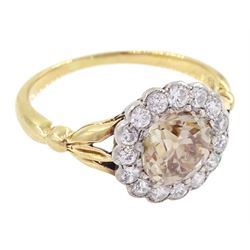 Early 20th century 18ct gold old cut diamond cluster ring, the central fancy light brown diamond of approx 1.60 carat, with a milgrain set white diamond surround of approx 0.45 carat, with Guest & Philips insurance valuation