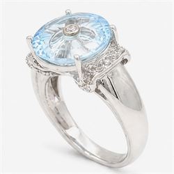 9ct white gold sky blue topaz and diamond Lehrer Torus ring, single round cut topaz of approx 5.20 carat, set with a single round cut diamond, diamond set shoulders and gallery, Birmingham 2012