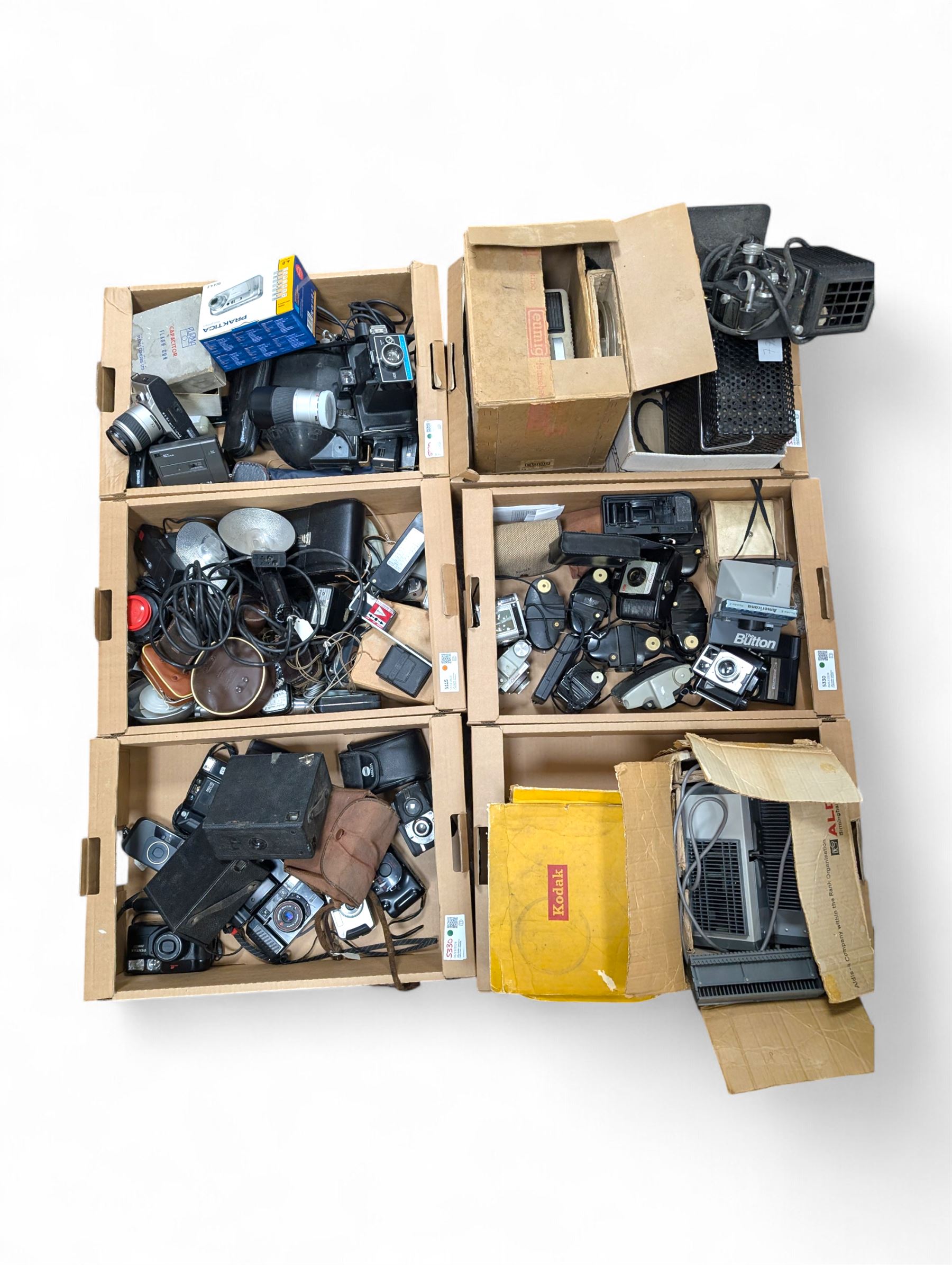 Collection of vintage cameras, projectors and accessories, including Kodak Brownies, Praktica, Polaroid, Ensign, light meters, flashes, etc