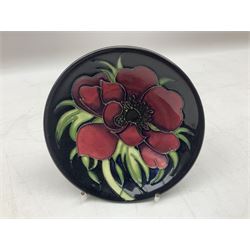 Moorcroft Clematis pattern plate and pin dish, both upon a blue ground with impressed marks beneath, plate D22cm