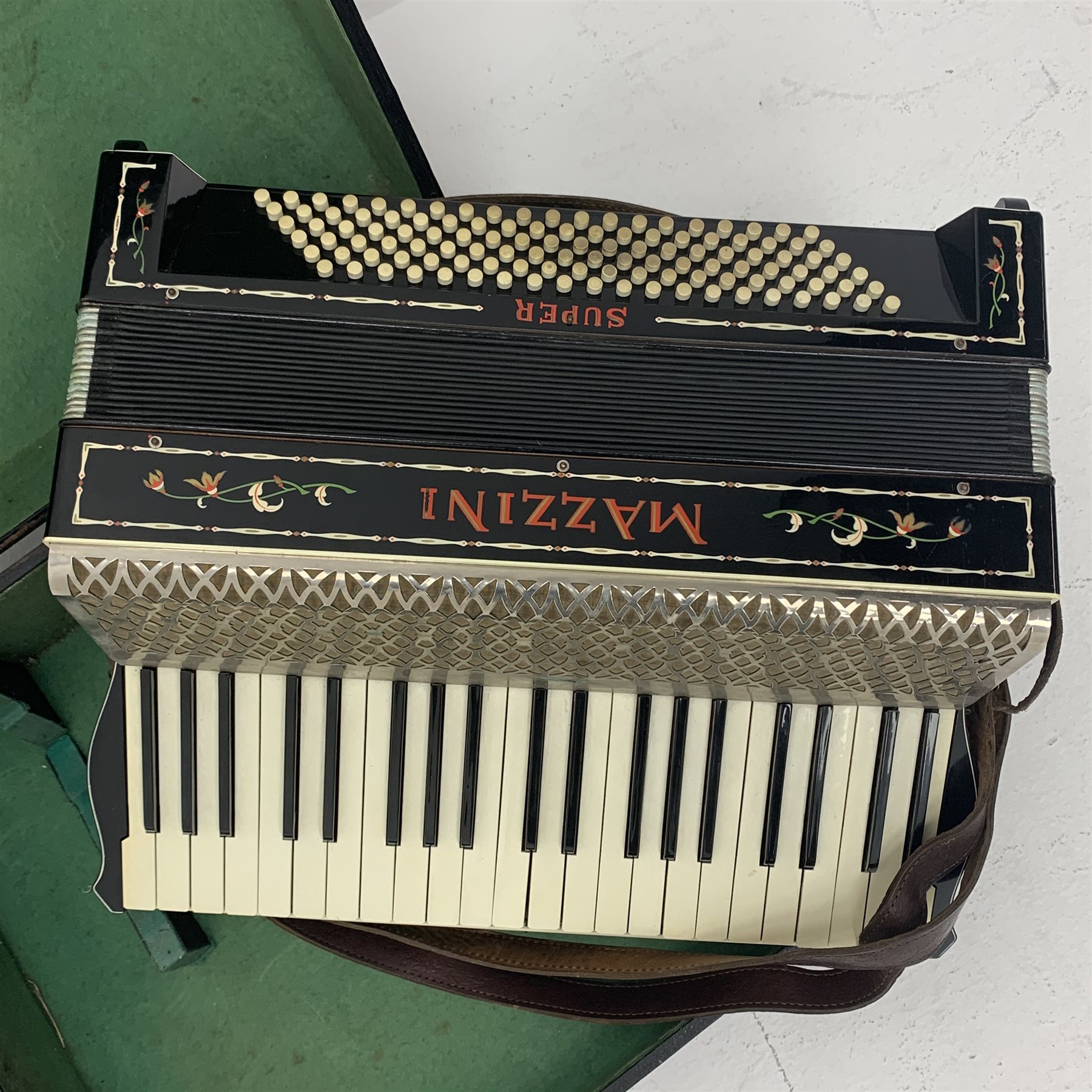 German Mazzini Super piano accordion with decorated black case, twenty-four keys and one hundred and twenty buttons, W51cm, in carrying case
