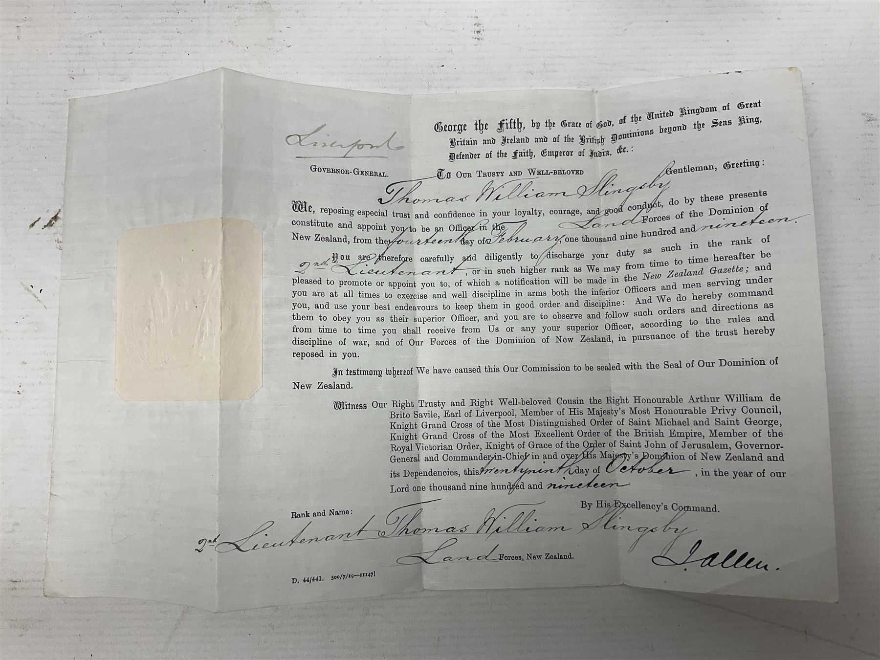 British Army Sam Brown leather belt with Turkish markings; New Zealand Land Forces officer's commission certificate dated 1919; WWII small pair of trench art brass helmet shaped scuttles; and other items