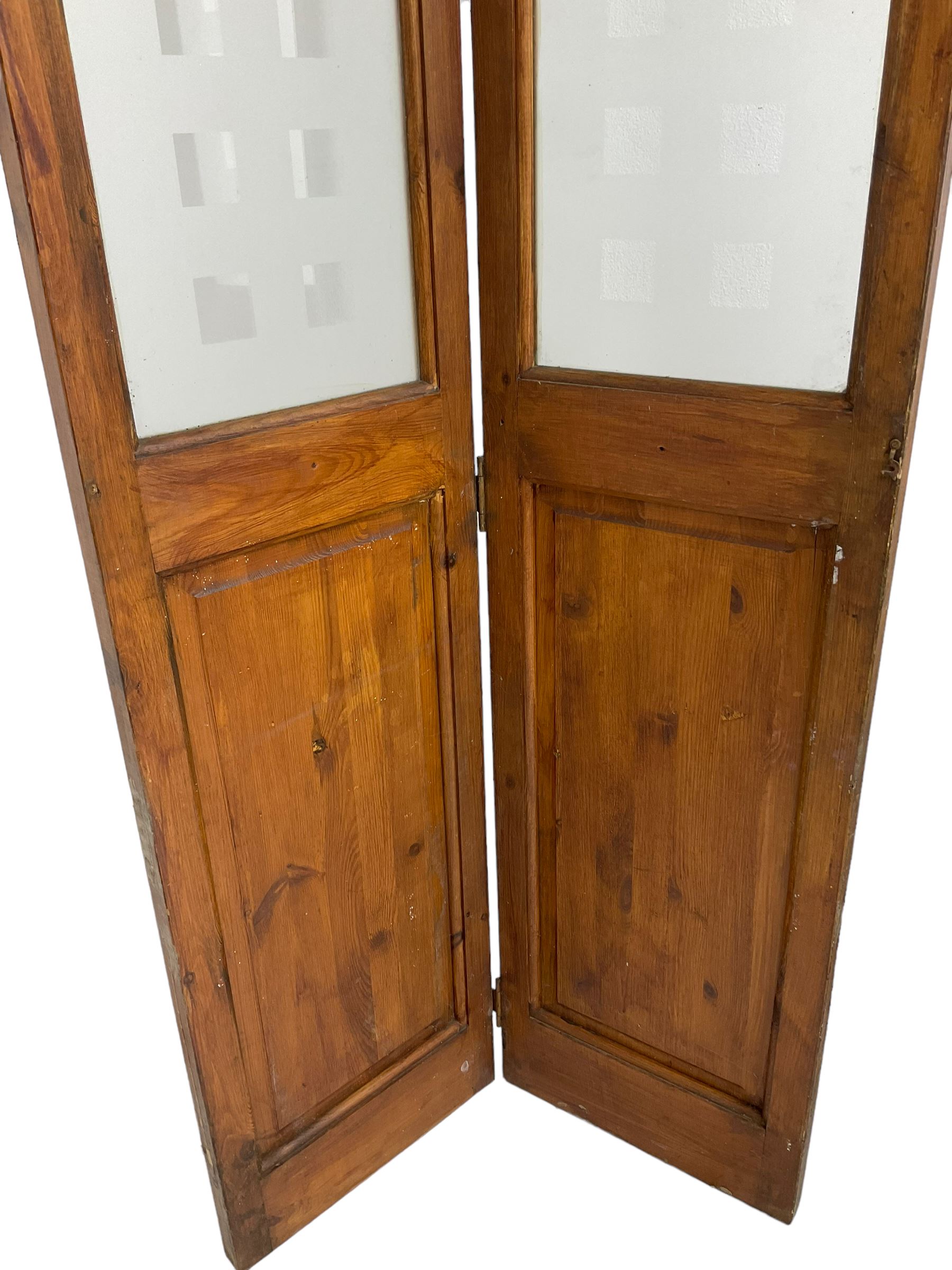 Two double pine room dividers or doors, frosted glass glazed with cube design over panels, in polish finish (74cm x 195cm each double total)