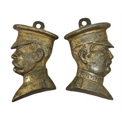 Two cast metal brassed wall mount plaques modelled as busts of Captain and soldier / lieutenant, L12cm