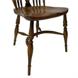 Set of four elm Windsor dining chairs, high hoop and stick back with shaped pierced splat, over shaped saddle seat, raised on ring turned supports joined by crinoline stretcher
