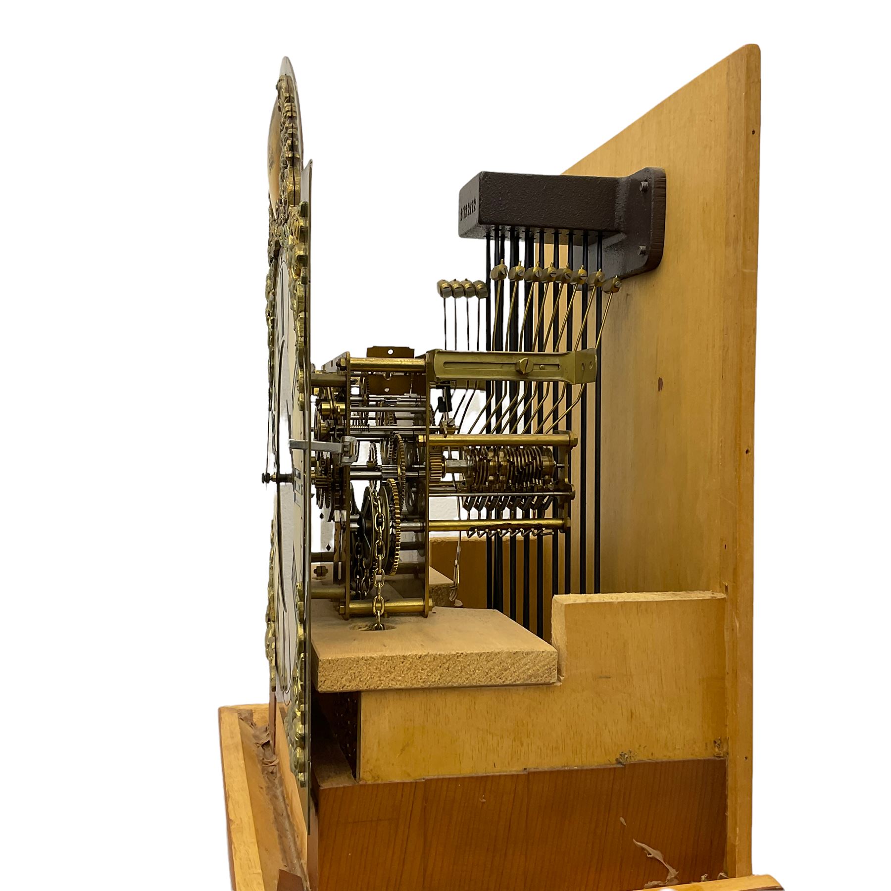 A bespoke handmade 20th century longcase clock in a slim Yew wood case with a German three train weight driven movement sounding the hours and quarters on 12 gong rods, with a brass break-arch dial, cast brass spandrels and an etched chapter ring, Roman numerals and minute track, dial engraved 'Parkinson Liner',  convex boss to the arch engraved 'Tempus Fugit', strike silent facility, With triple weights & Pendulum. 


