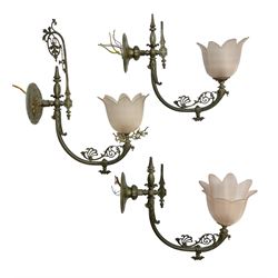 Set of three early 20th century brass wall lights with opaque pink glass shades in the form of flowers, H37cm D40cm