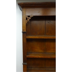  19th century oak dresser, projecting conrice, three shelf plate rack, two short and four long drawers, two cupboard doors, shaped bracket supports, W170cm, H209cm, D50cm  