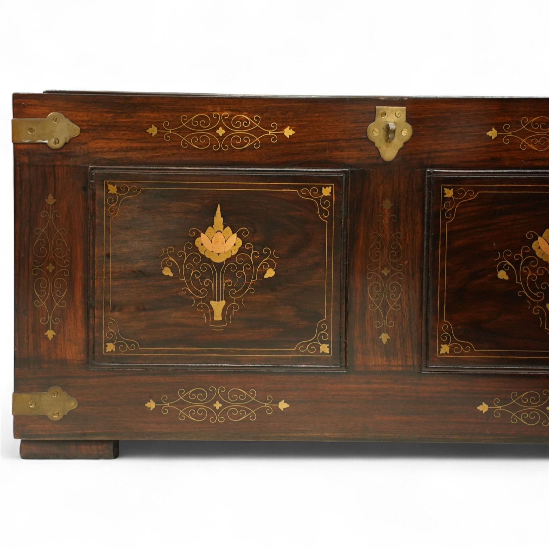 Pair of late 19th century colonial hardwood and brass inlaid chests, each rectangular with hinged top and brass strapping, floral and urn pattern inlay to the panels, with pierced brass side handles, fitted baize-lined butlers tray