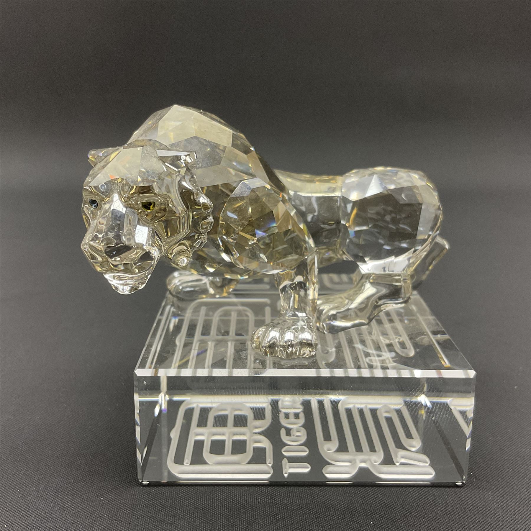 Two Swarovski Crystal Signs of the Zodiac figures, comprising horse and tiger, together with Zodiac dragon holding the flaming pearl, largest H11cm 