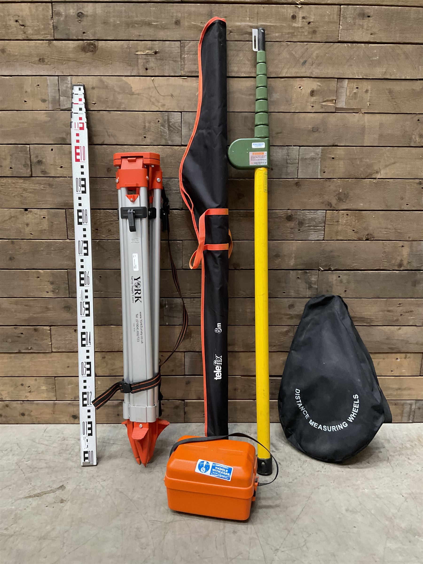 Collection of surveyors equipment including an automatic level and tripod stand and Hilka Pro Craft distance measuring wheel