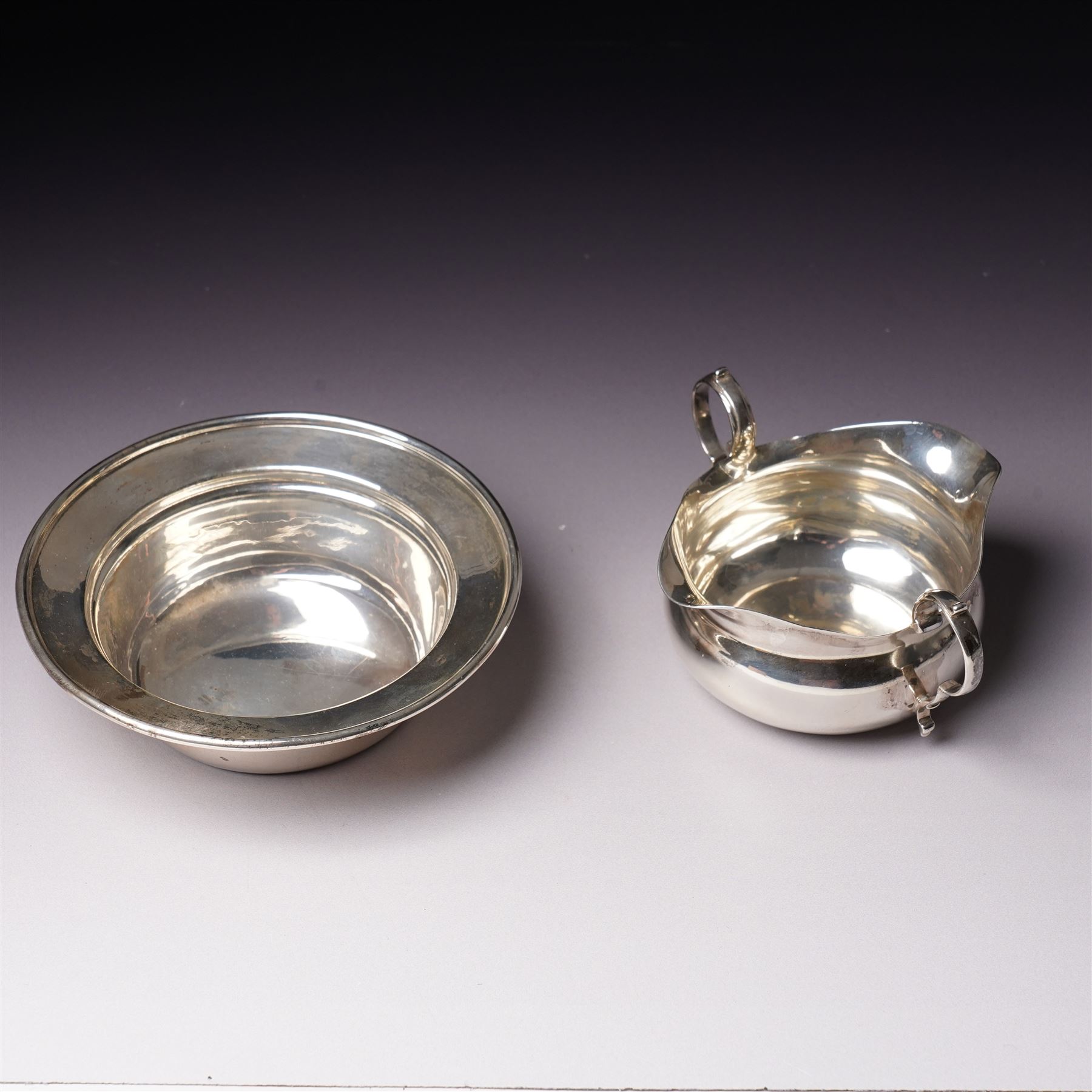 Edwardian silver two handled double lipped sauce boat Chester 1905 Maker Stokes & Ireland Ltd and a silver bowl D12cm Sheffield 1910 