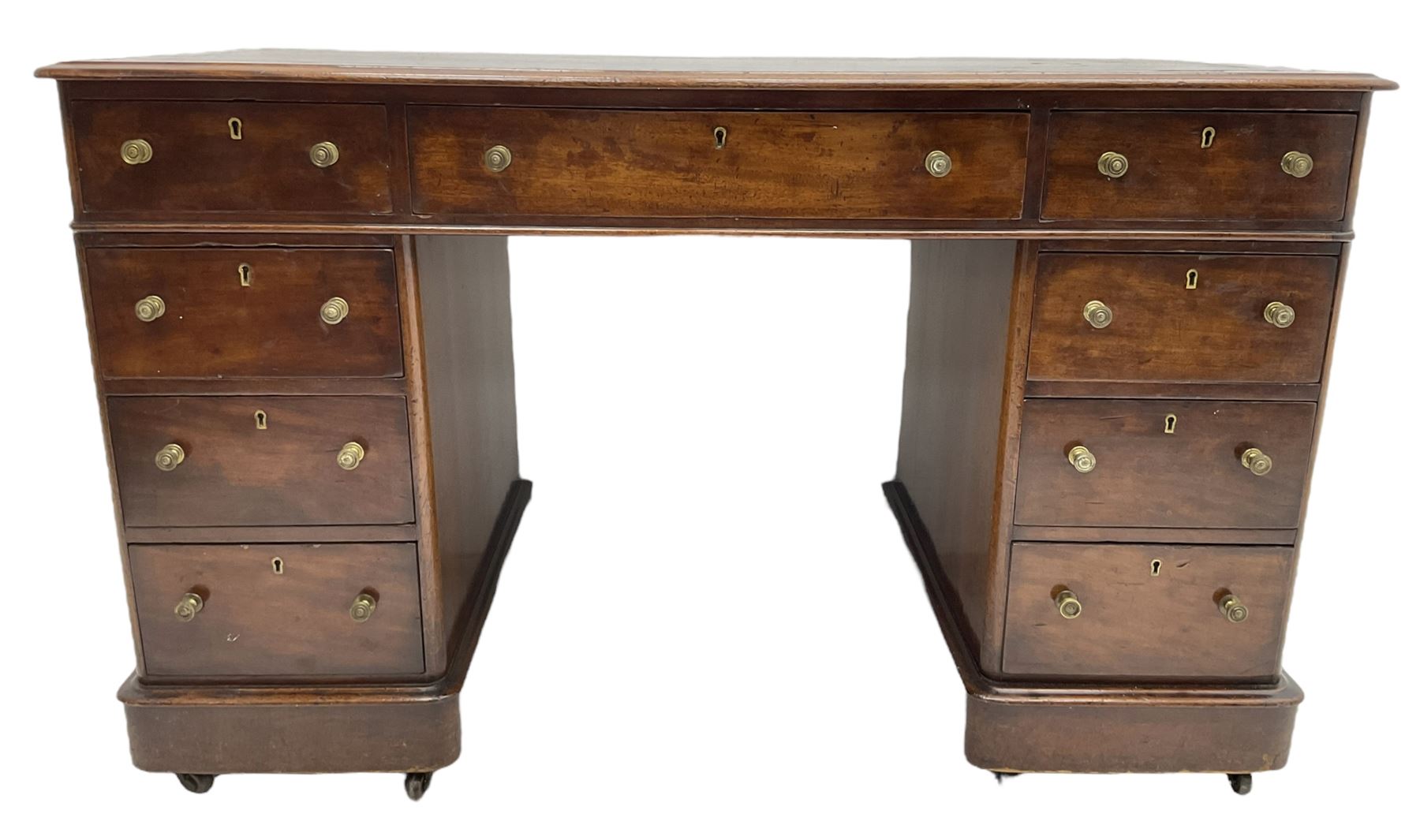 Victorian mahogany twin pedestal desk, rectangular top with inset ebonised leather writing surface, fitted with nine graduating drawers with brass pull handles, on plinth bases