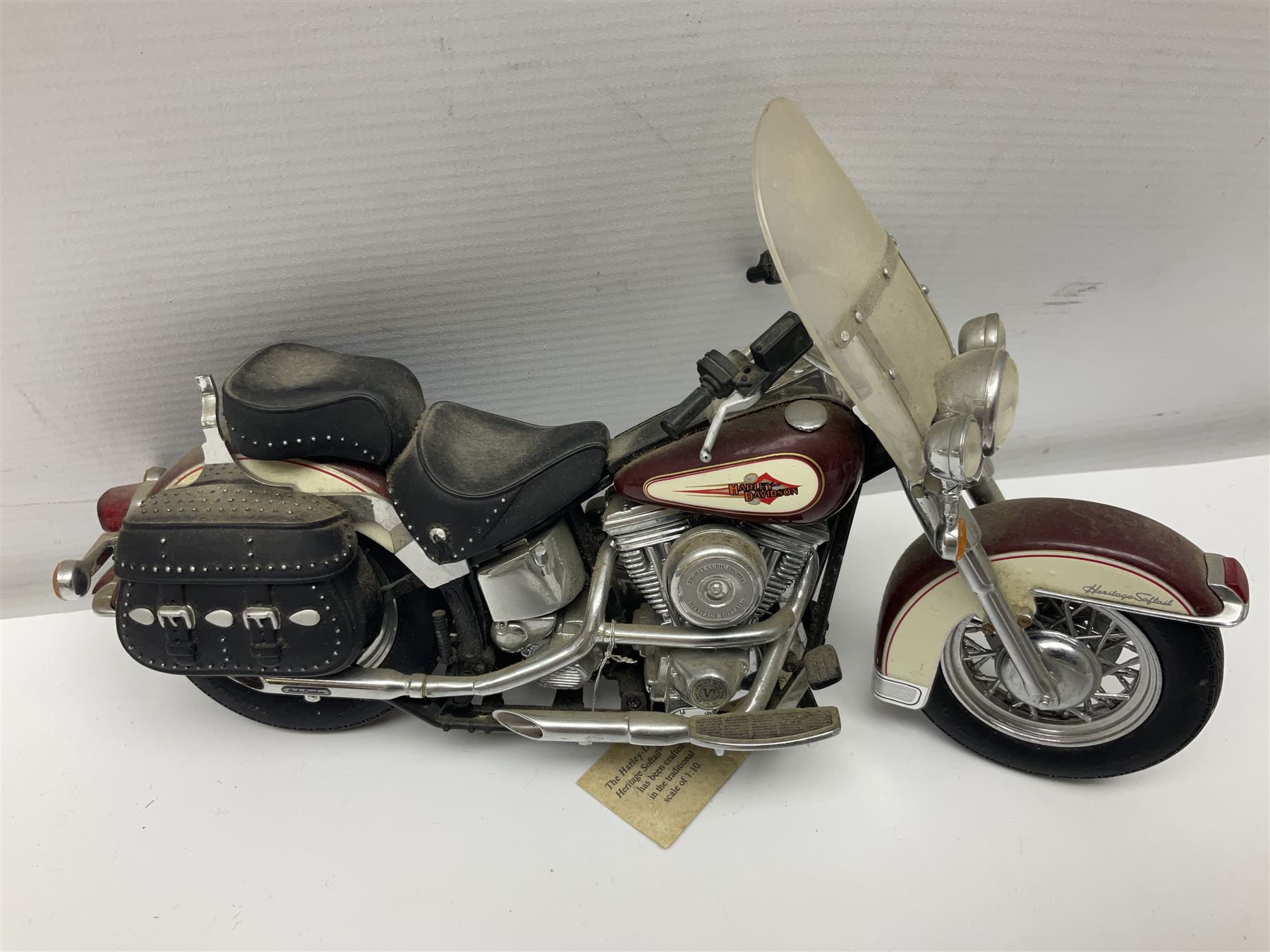 Franklin Mint - three die-cast models comprising 1:10 scale Harley Davidson Heritage Softail motorcycle, 1:24 scale 1957 VW Beetle and 1:24 scale 1993 Rolls Royce Corniche IV; all unboxed (3)