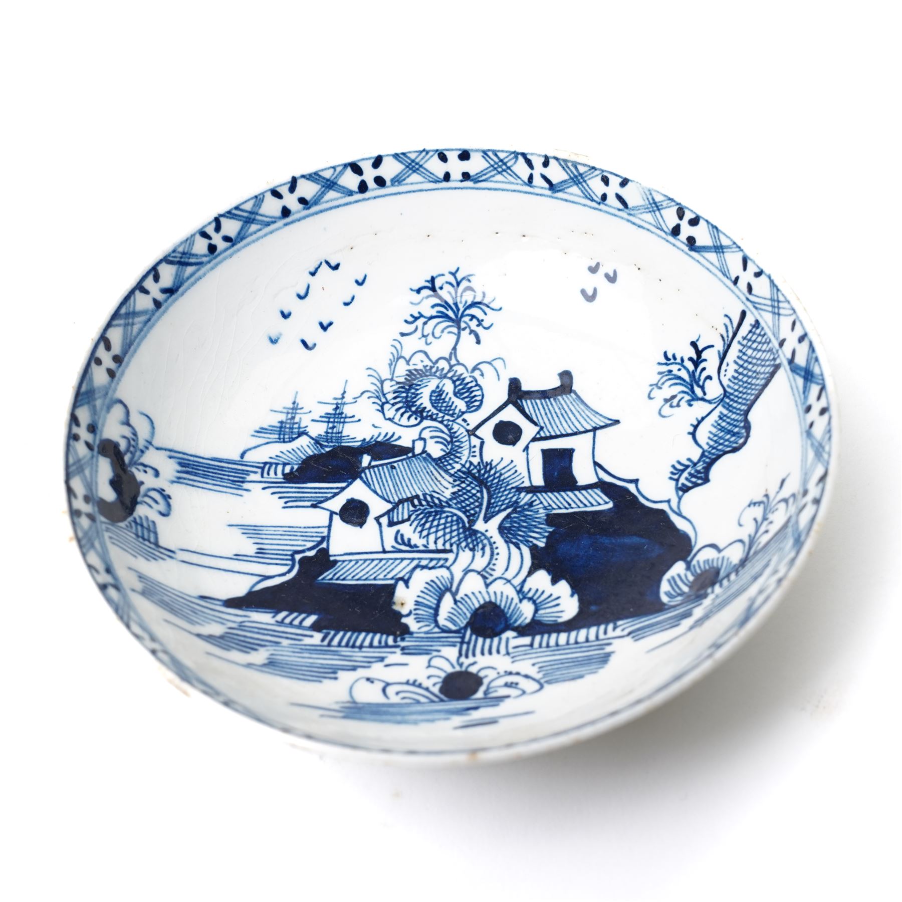 18th century Lowestoft porcelain coffee cup and saucer painted in the 'Two Pagoda Island' pattern, c1765-75, coffee cup H5.5cm