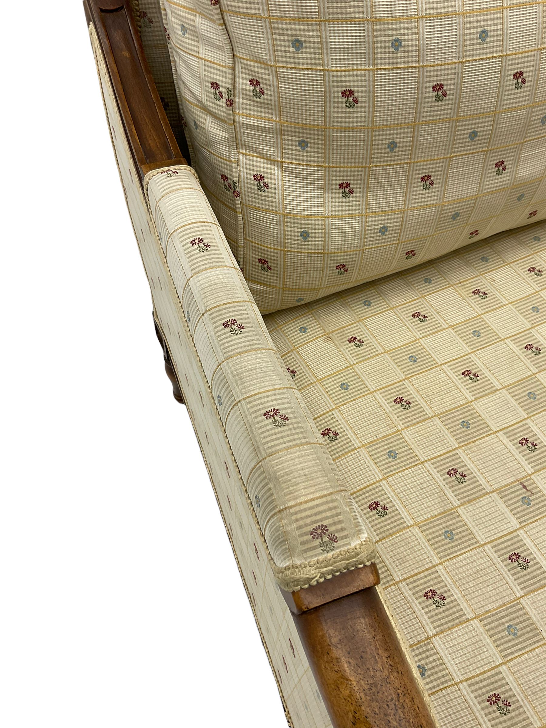 Wesley Barrell - beech framed armchair, upholstered in floral patterned fabric, on turned supports