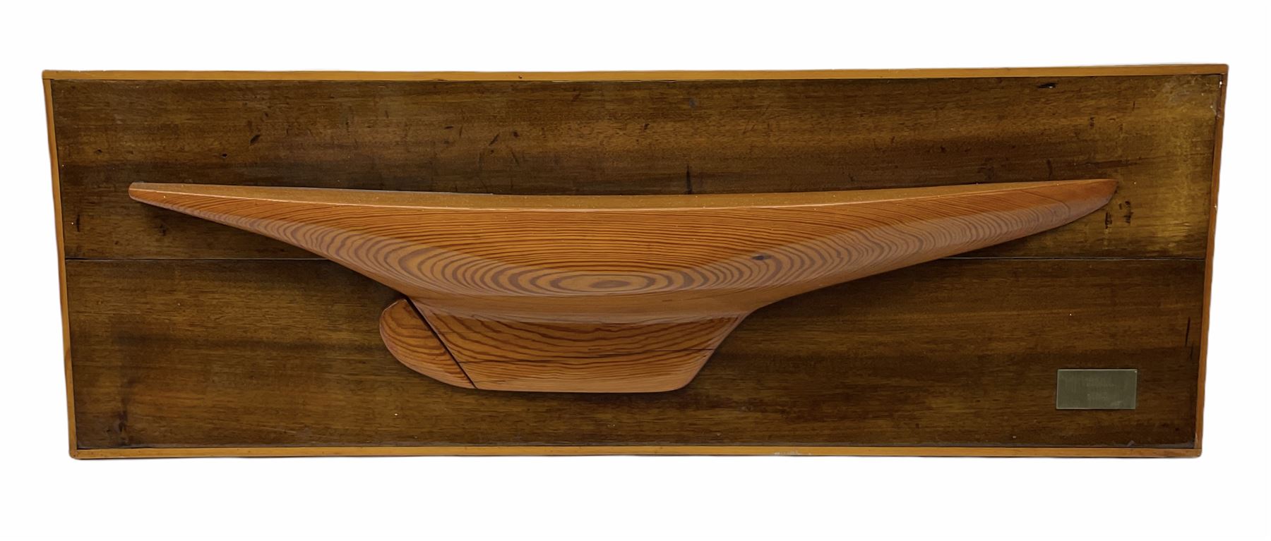Ship builders half block pitch pine hull model upon mahogany backboard, bearing plaque 'Troll 1905', L103.5cm H35cm