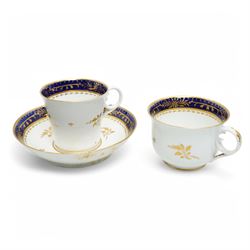  19th century Coalport Felt Spar porcelain cup and saucer painted with panels of flowers on a green and gilt ground and marked I Rose & Co and an early 19th century Worcester trio decorated in blue and gilt, Pattern No.274 
