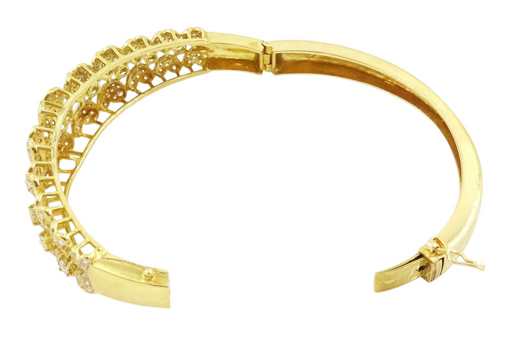 18ct gold diamond heart bangle, two rows of eleven graduating heart motifs, each set with pave set diamonds, spaced by ten round brilliant cut diamonds, total diamond weight approx 1.90 carat