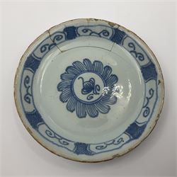 Rare 18th century English delft coffee cup and saucer, circa 1760, probably Liverpool, the cup painted with rockwork, flowers and bird, the saucer painted with central stylised flower head and lattice and scroll border, cup H6cm, saucer D10.5cm