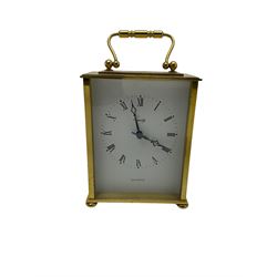 Three quartz mantle clocks and one 1930s mantle clock