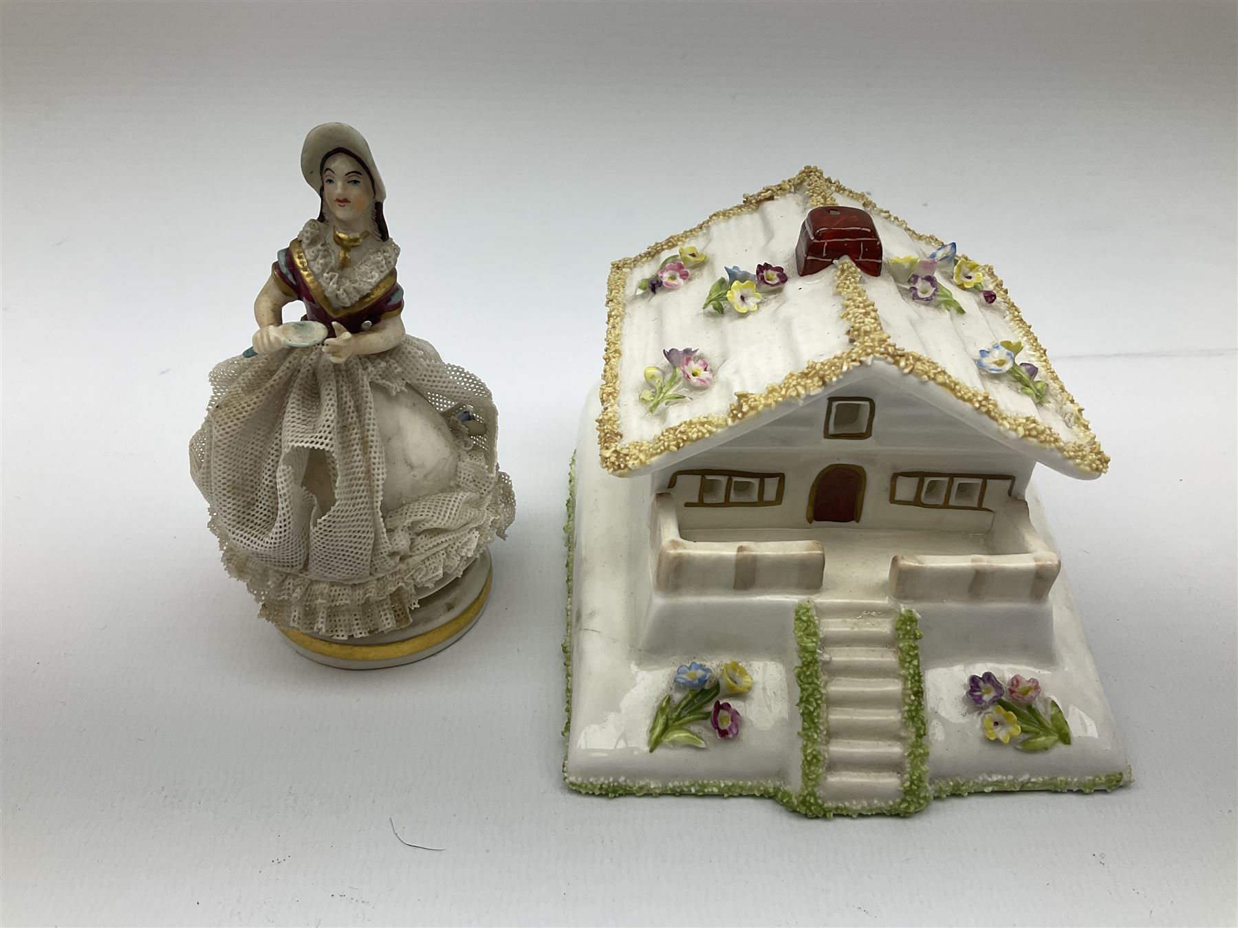 Group of figures, comprising six Royal Doulton examples, Daydreams HN1731, Silks and Ribbons HN2017, Tom Sawyer HN2926, Marie HN1370, Bo-Peep HN1811, and Tinkle Bell HN1677, together with a Dresden type 'lace' example, and a Coalport 'Swiss Cottage', (8)