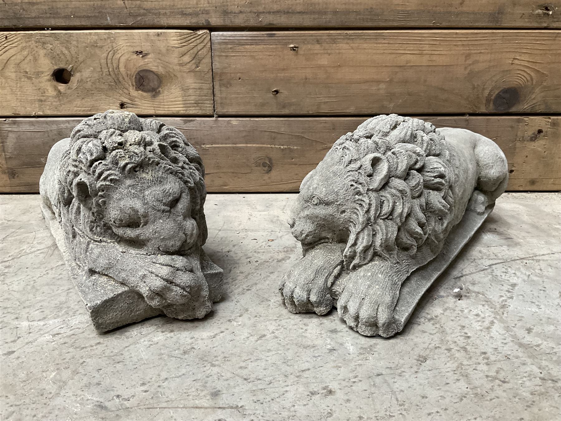 Pair of small cast stone sleeping Trafalgar Lions