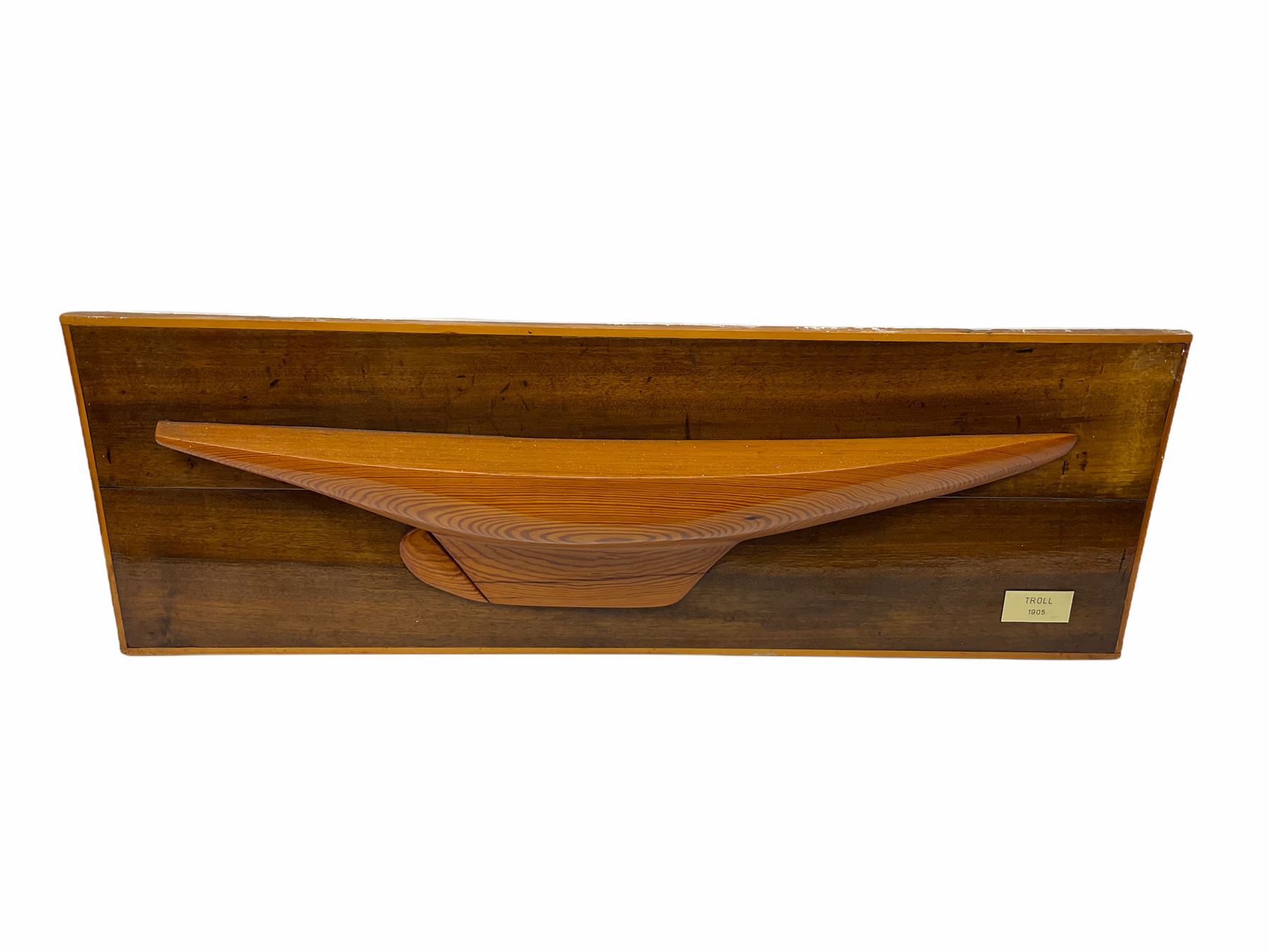 Ship builders half block pitch pine hull model upon mahogany backboard, bearing plaque 'Troll 1905', L103.5cm H35cm