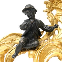 Pair of gilt metal Louis XIV style chenets, mounted with two bronze figures of a boy and girl, H29cm W30cm 