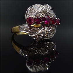  Ruby and diamond scroll ring, five graduating central rubies with diamond surround, unmarked  