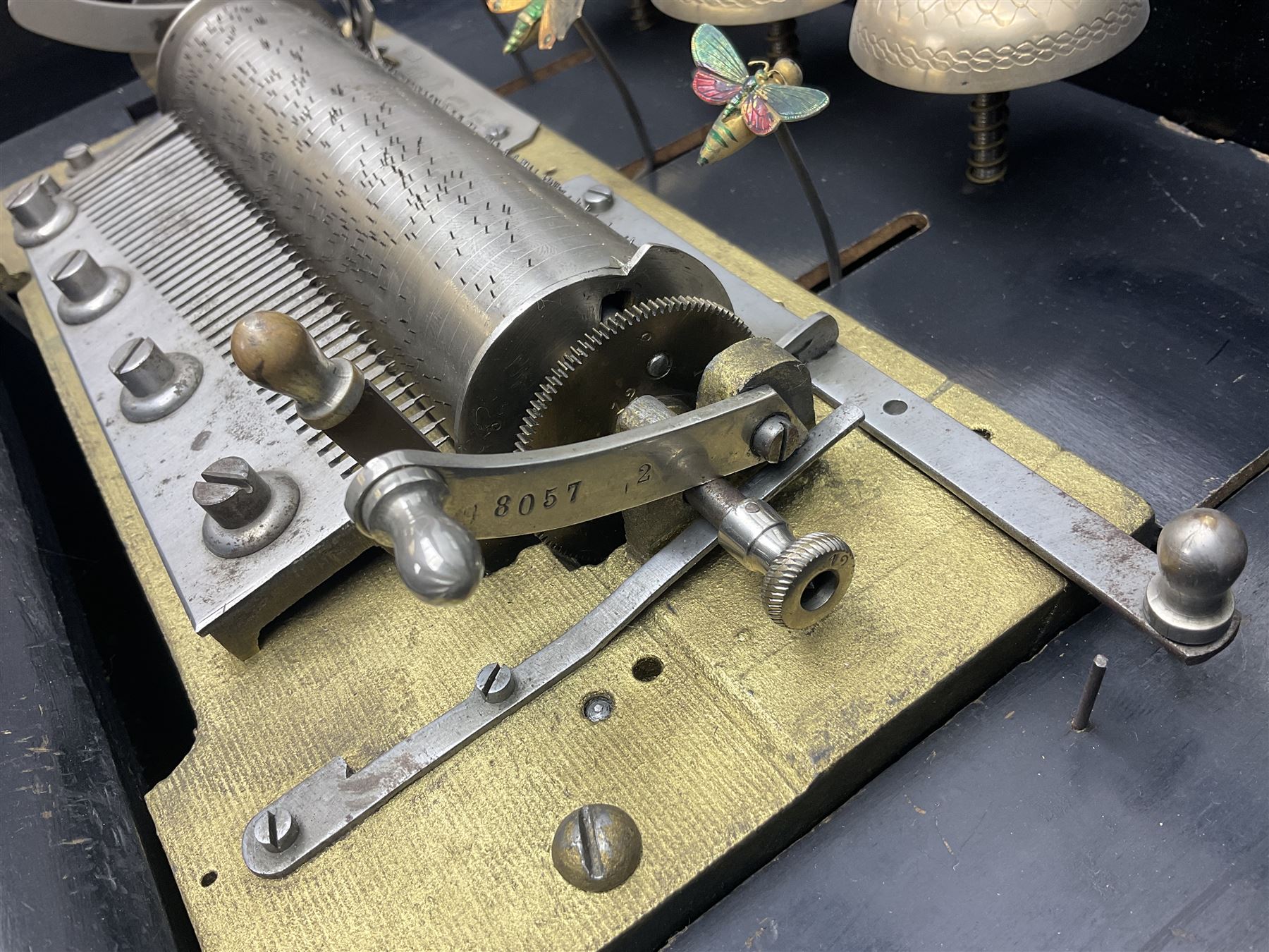 Swiss - 19th-century cylinder music box with three butterfly bells in sight, in a mahogany case with two separately boxed  6” cylinders, glazed viewing lid, 41 tooth comb (one tooth broken) crank key missing, movement untested.