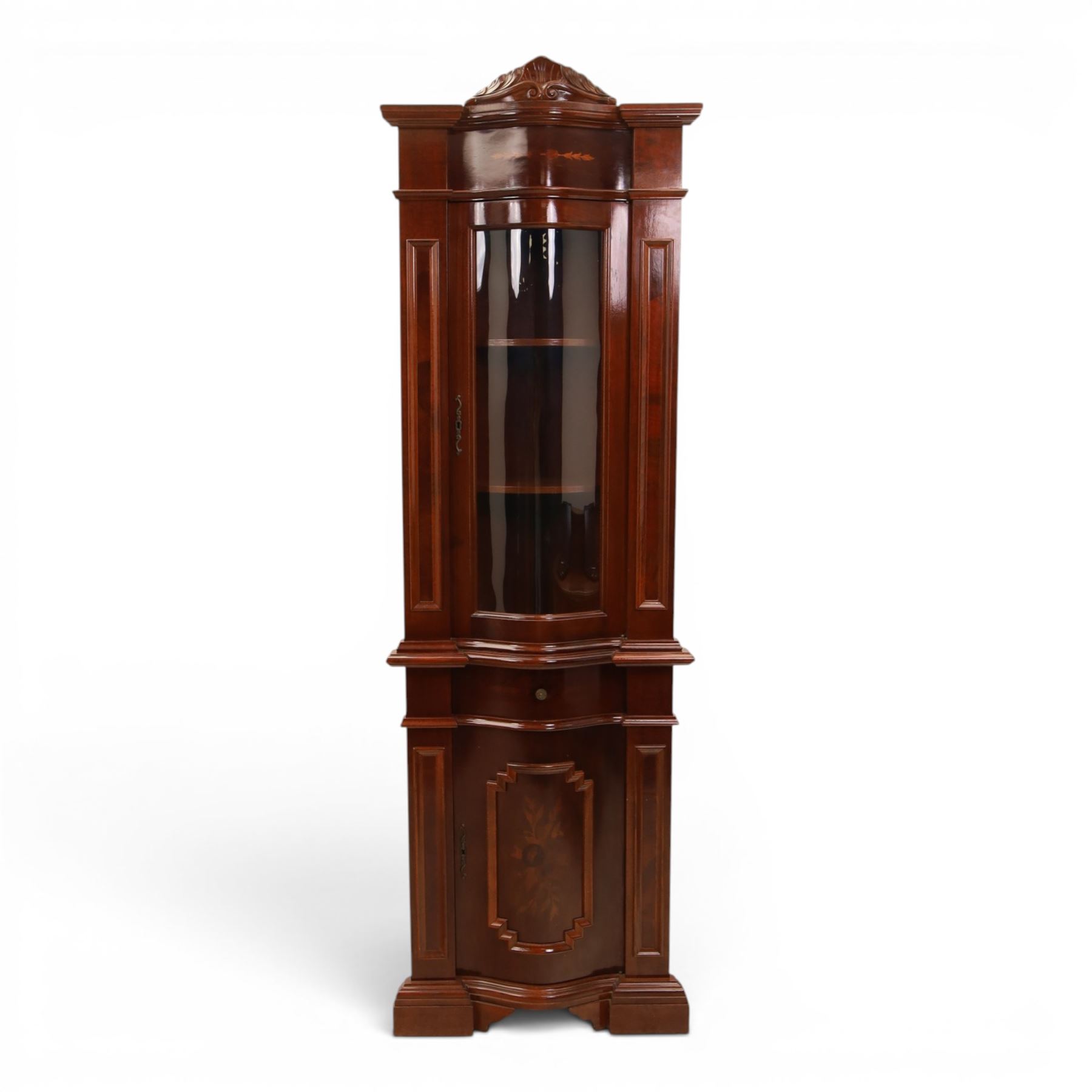 Victorian design mahogany corner cabinet, shaped carved cresting above bowed glazed upper door, with panelled side uprights, lower drawer over cupboard door decorated with floral marquetry, on plinth base