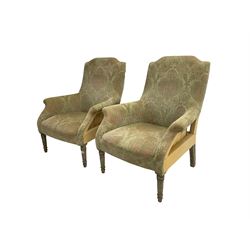Pair Edwardian design armchairs, upholstered in foliate patterned fabric, on turned supports