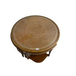 Yew wood circular coffee table with four nesting tables, inset leather and glass tops, on turned and fluted supports