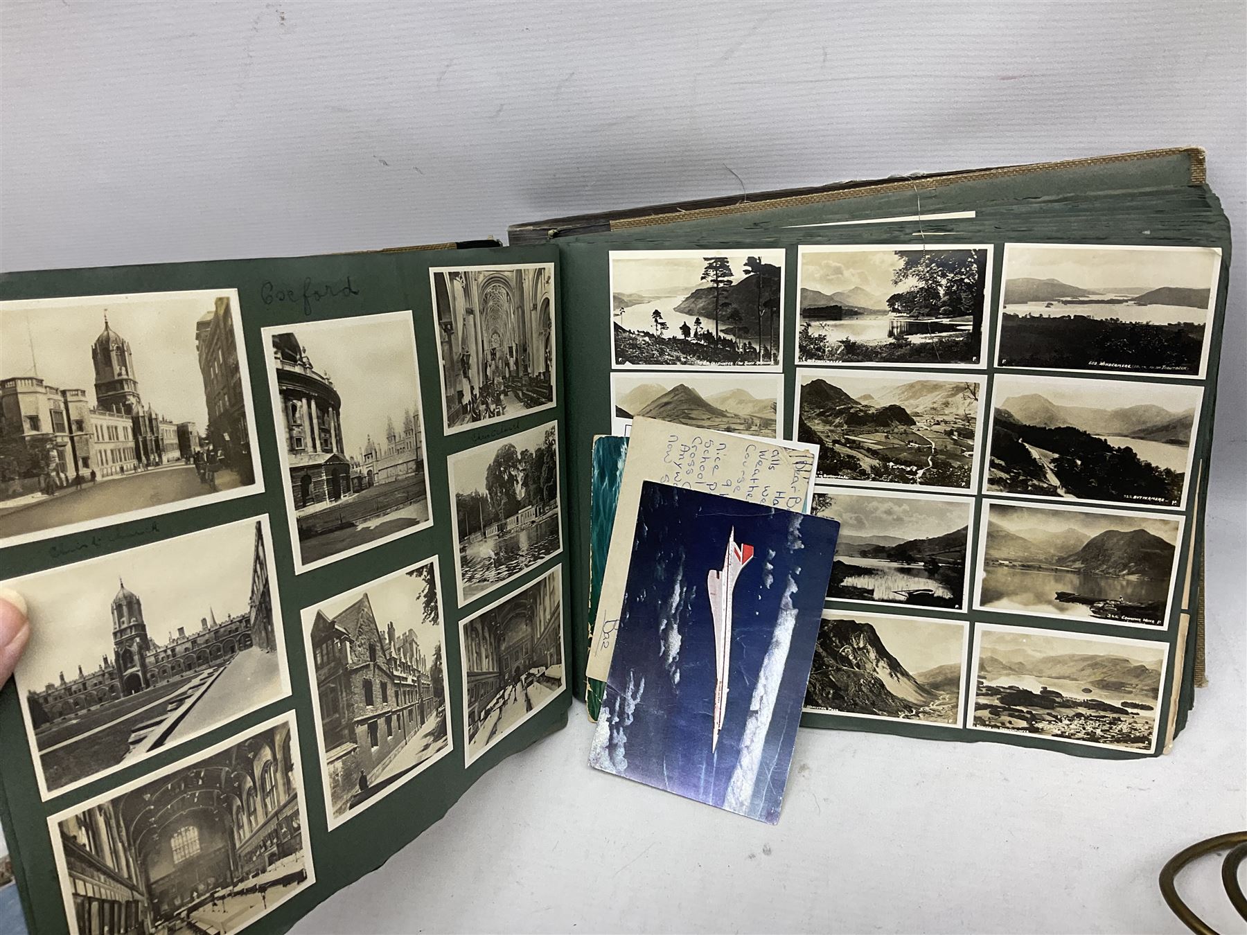 Quantity of post cards in six albums, local interest and photographic postcards, together with an art deco style table lamp