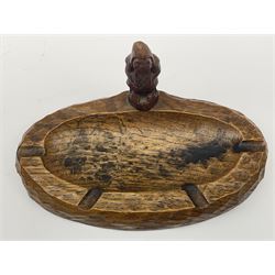 'Gnomeman' tooled oak ashtray of elongated oval form, mounted with carved standing gnome signature, by Thomas Whittaker of Littlebeck