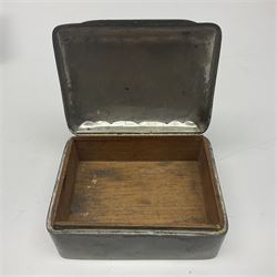 Liberty & Co Tudric pewter cigarette box, of plain rectangular form, with planished decoration to the slightly domed cover, opening to reveal a softwood interior, stamped Made in England 01234 Tudric Solkets beneath, together with another cigarette box, with applied pewter panels repousse decorated throughout with flower heads and leaves, with compartmentalised softwood interior, largest H5.5cm, W23cm