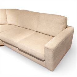 Contemporary modular corner sofa, upholstered in neutral fabric, with curved back fitted with loose cushions and wide seat pads, padded scroll arms and block feet, designed as three detachable sections