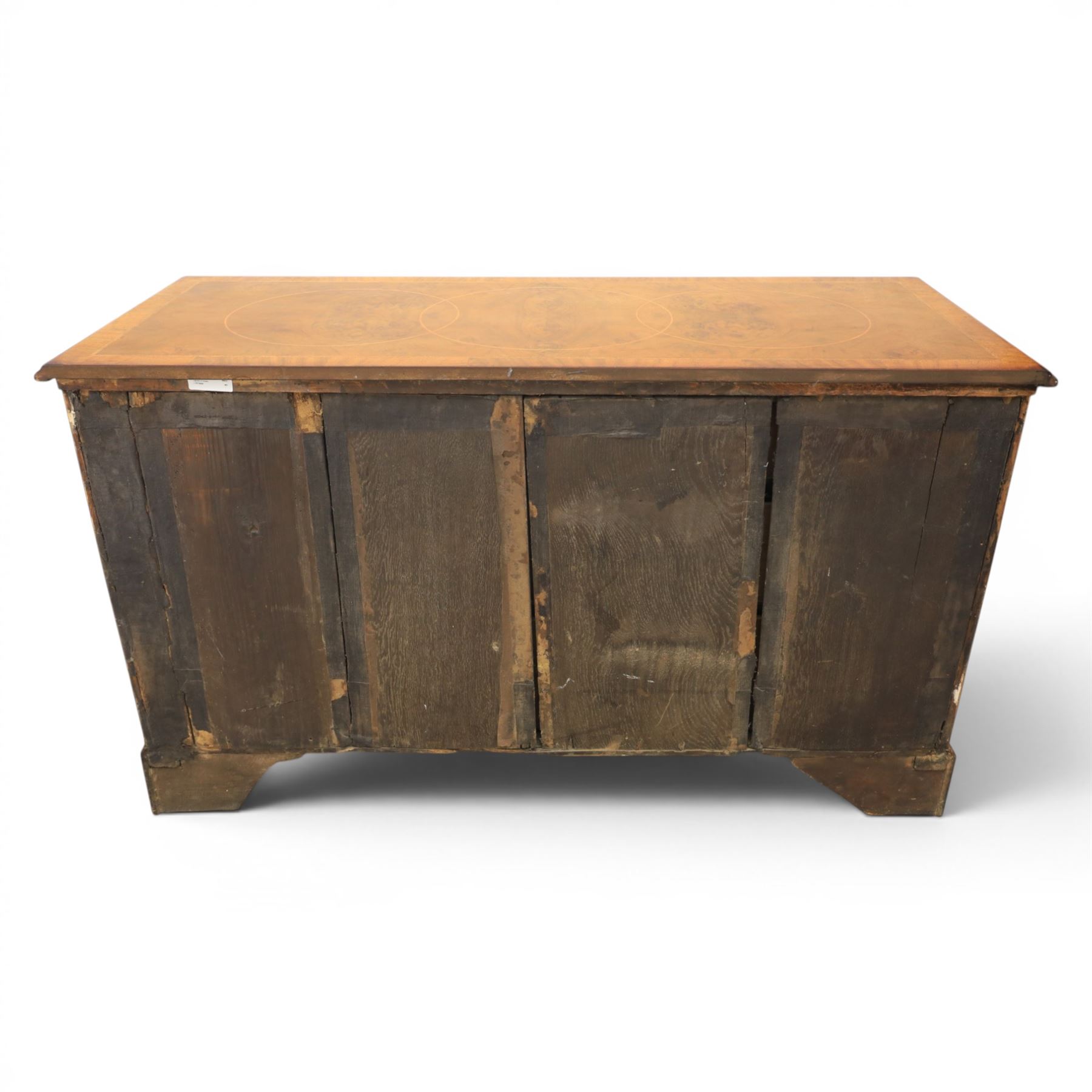 Traditional design walnut inlaid chest, with figured top with circular inlay and crossbanded top with moulded edge, figured drawers with cockbeaded edges and brass handles, raised on bracket feet