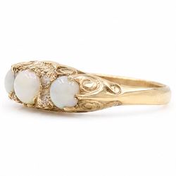 9ct gold three stone opal ring, with four diamond accents set between, Birmingham, 1971