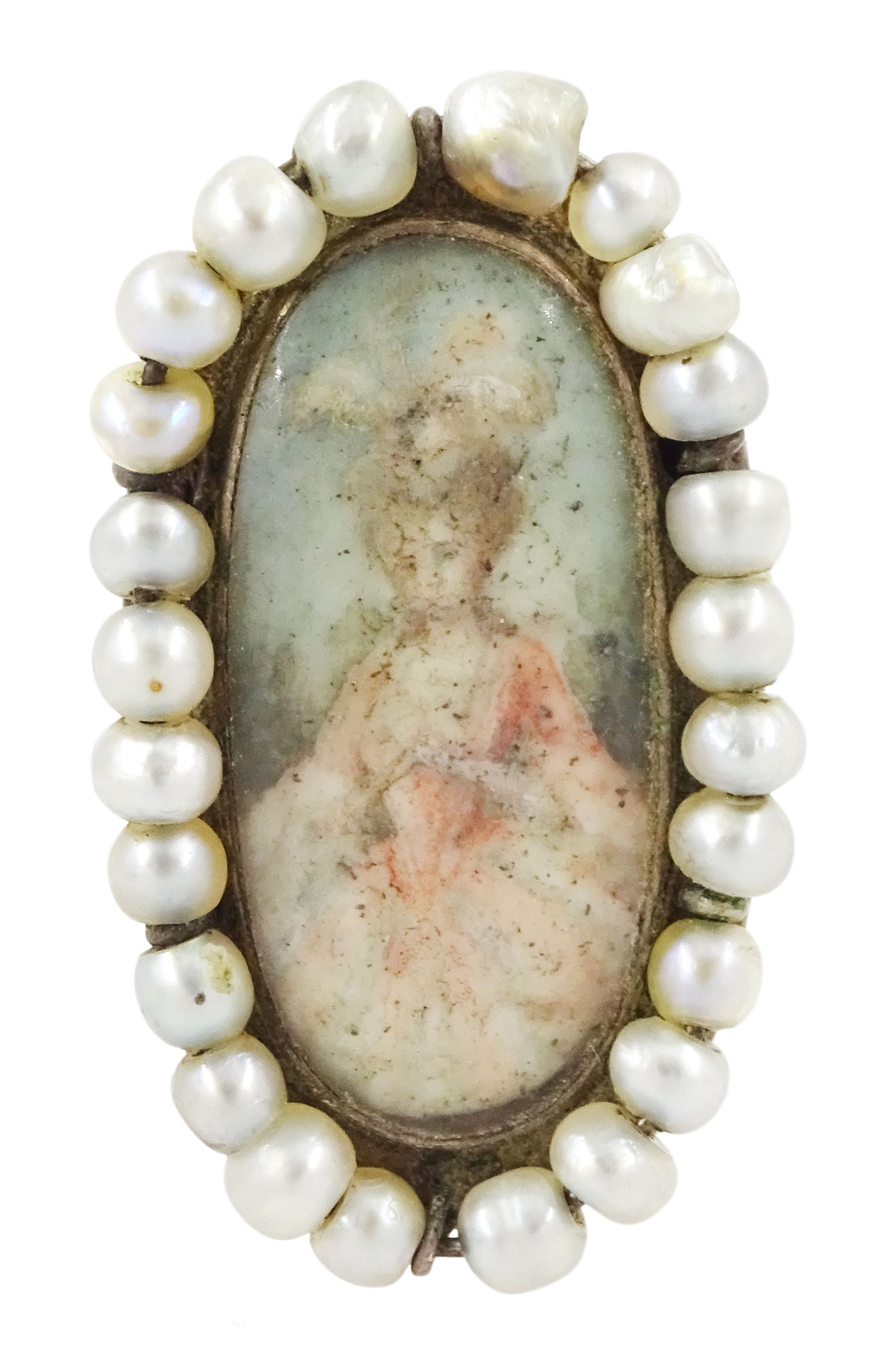 19th century portrait ring, set with an oval miniature of a woman wearing a pink dress on ivory, under a glazed panel, with threaded pearl surround and engraved shoulders. This lot has been registered for sale under Section 10 of the APHA Ivory Act