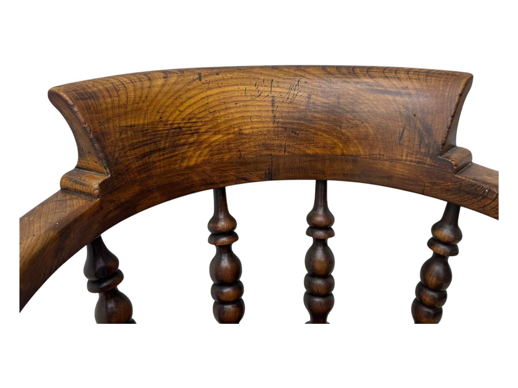 Victorian elm captains smokers bow chair, spindle turned tub shaped back, saddle seat, seat height 41cm